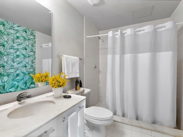 bathroom with tile patterned flooring, vanity, toilet, and a shower with curtain