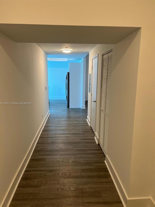 hall featuring dark wood-type flooring