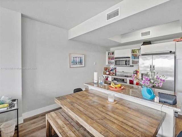 dining area featuring hardwood / wood-style floors