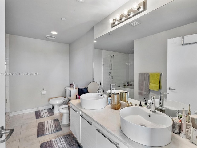 bathroom featuring tile patterned flooring, vanity, walk in shower, toilet, and a bidet