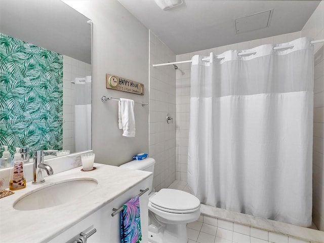 bathroom with vanity, a shower with shower curtain, tile patterned floors, and toilet