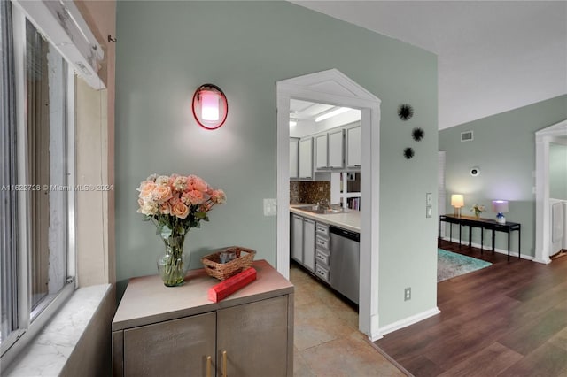 hall with sink and hardwood / wood-style flooring