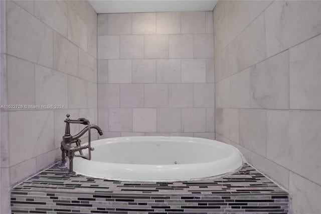 bathroom with tiled bath