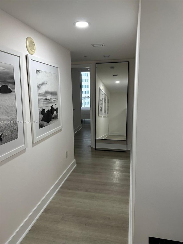 hall with dark hardwood / wood-style floors