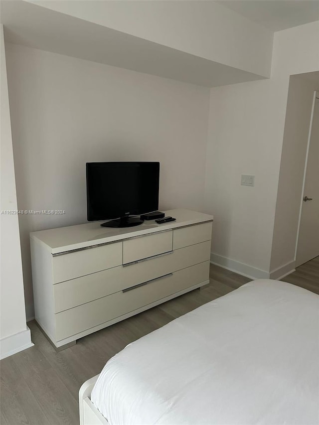 bedroom with light wood-type flooring