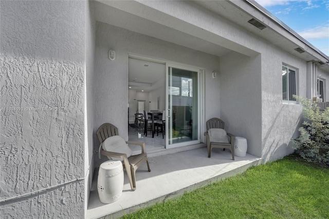 rear view of house featuring a patio area and a lawn