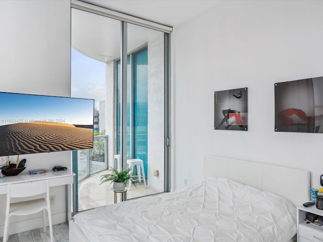 bedroom featuring expansive windows
