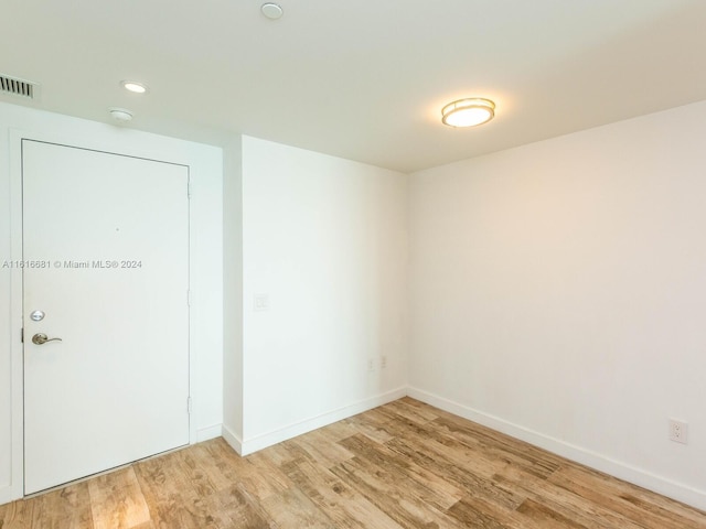 unfurnished room featuring light wood-type flooring