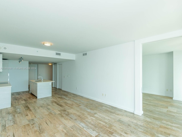 spare room featuring light hardwood / wood-style floors