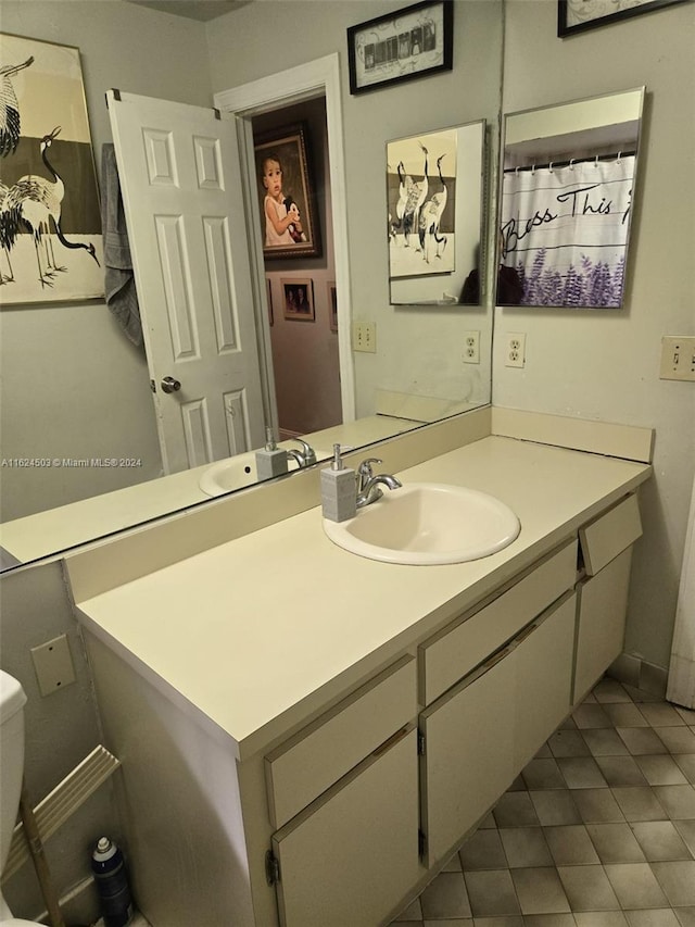 bathroom featuring tile patterned floors and vanity