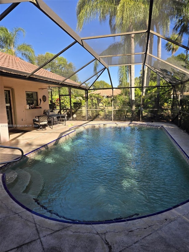 view of pool featuring a lanai and a patio area