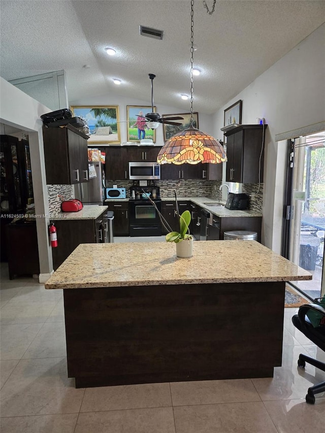 kitchen with hanging light fixtures, black electric range oven, a textured ceiling, vaulted ceiling, and a kitchen island