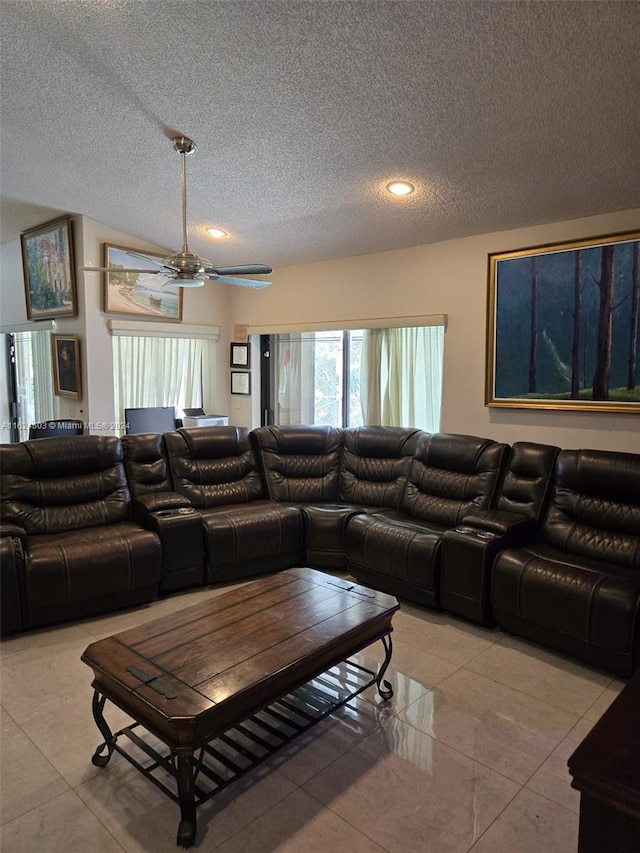 living room with light tile patterned floors, a textured ceiling, and ceiling fan