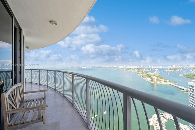 balcony featuring a water view