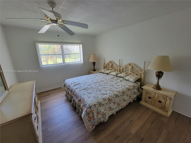 bedroom with ceiling fan and dark hardwood / wood-style floors