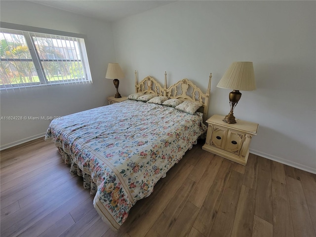 bedroom featuring wood-type flooring