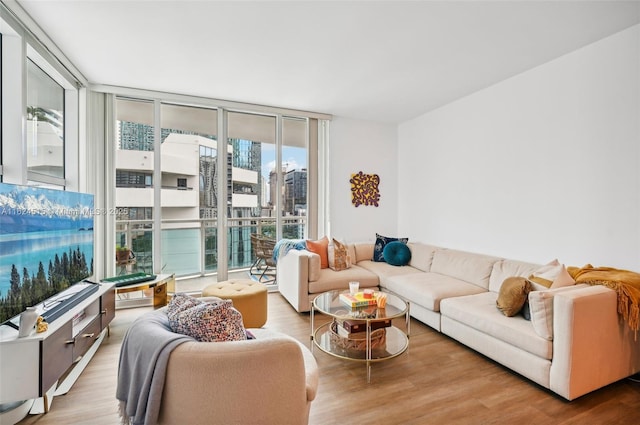 living room with expansive windows and wood-type flooring