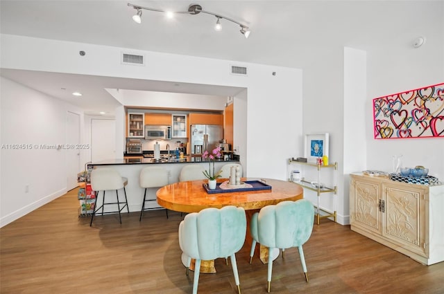 dining area with light hardwood / wood-style flooring