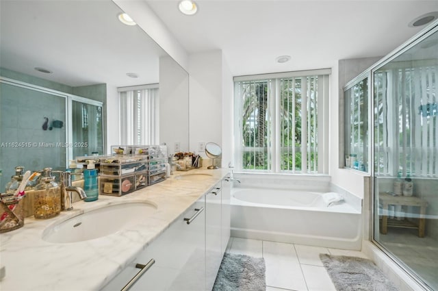 bathroom featuring tile patterned flooring, vanity, and plus walk in shower