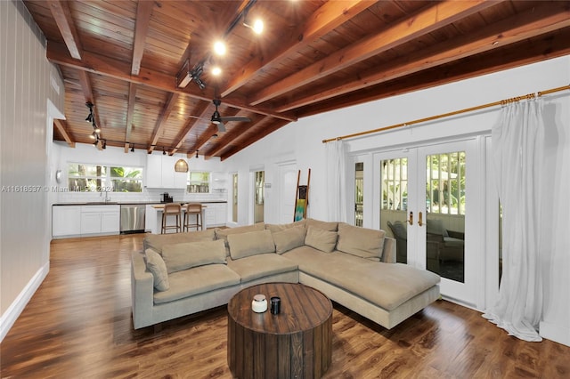 living room featuring lofted ceiling with beams, track lighting, hardwood / wood-style floors, french doors, and wooden ceiling