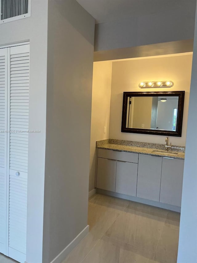 bathroom featuring vanity and tile patterned flooring