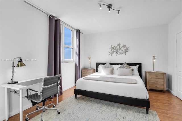 bedroom featuring hardwood / wood-style floors