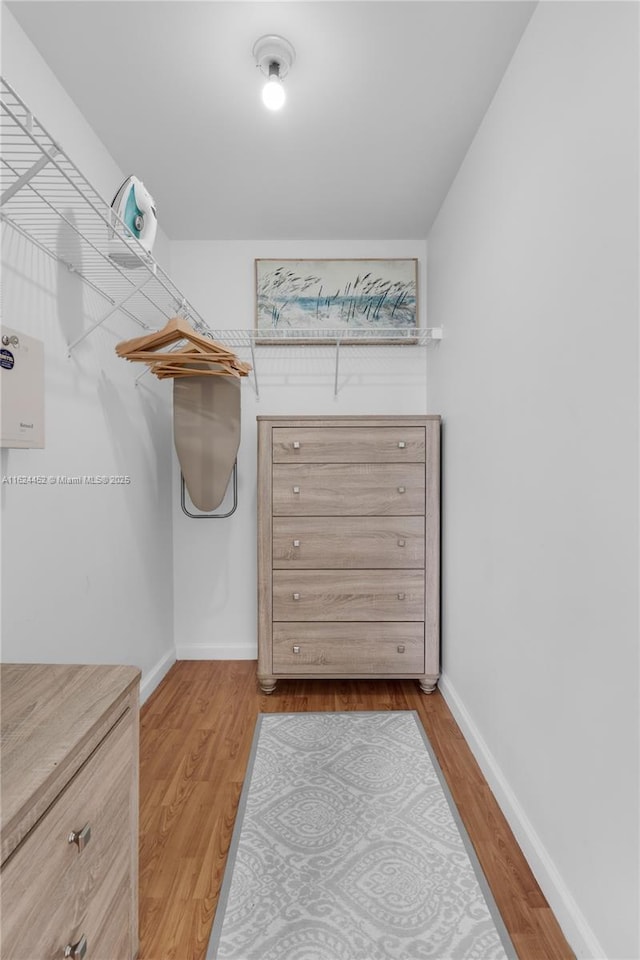 spacious closet featuring hardwood / wood-style flooring