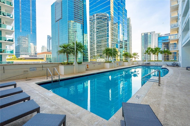 view of swimming pool with a patio