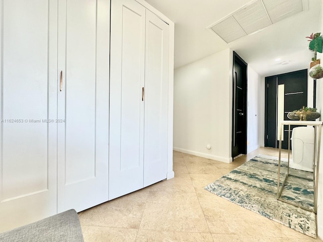 tiled bedroom featuring a closet