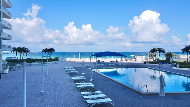 view of pool with a water view