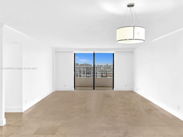 unfurnished room featuring ornamental molding