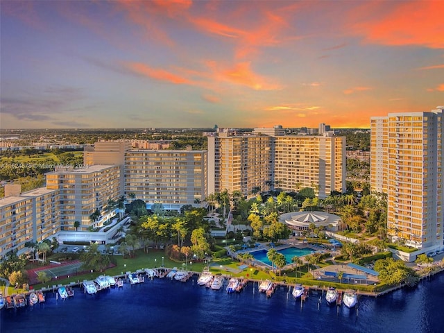 aerial view at dusk with a water view