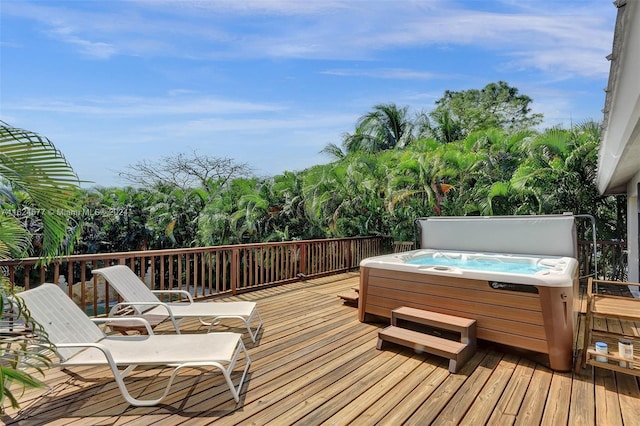wooden terrace with a hot tub
