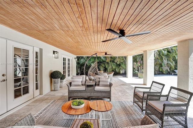 view of patio / terrace featuring ceiling fan, an outdoor hangout area, and french doors