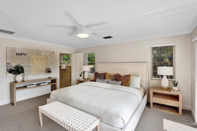 bedroom with visible vents, baseboards, carpet flooring, and ornamental molding