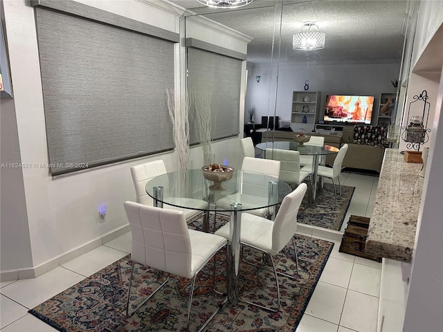 tiled dining room with a textured ceiling