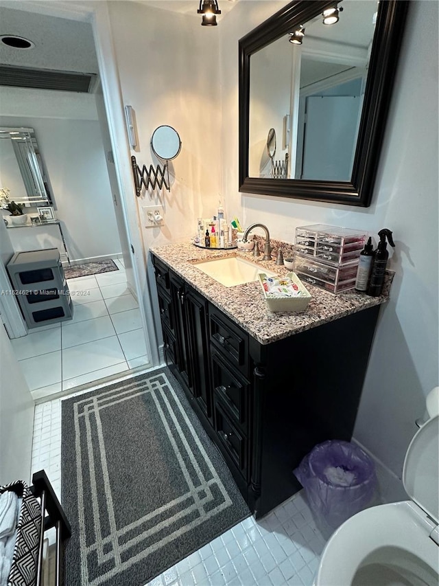 bathroom with tile patterned flooring and vanity