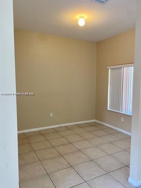 view of tiled spare room