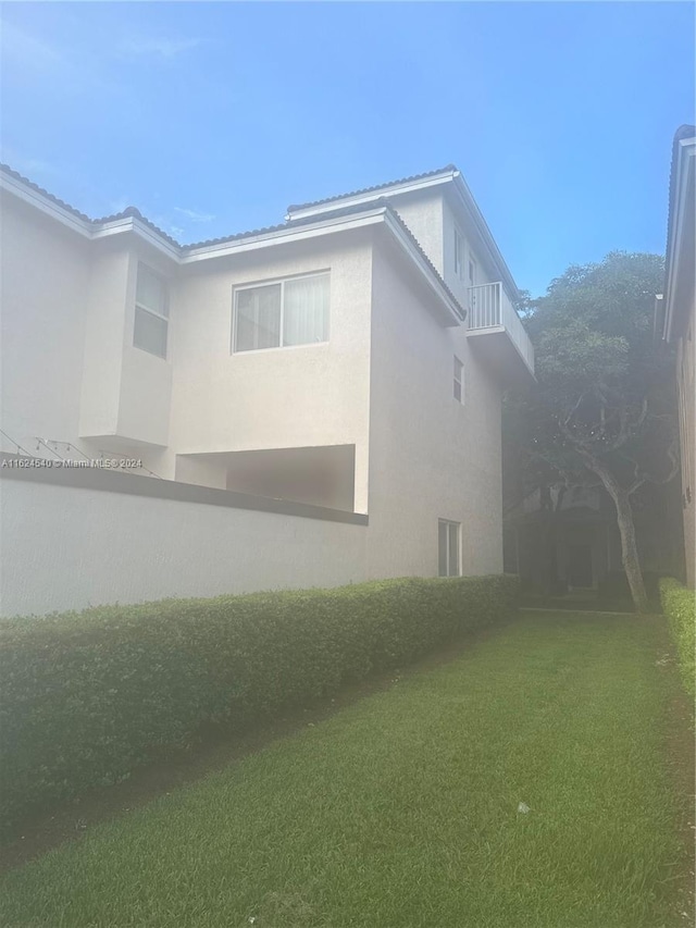 view of home's exterior featuring a lawn