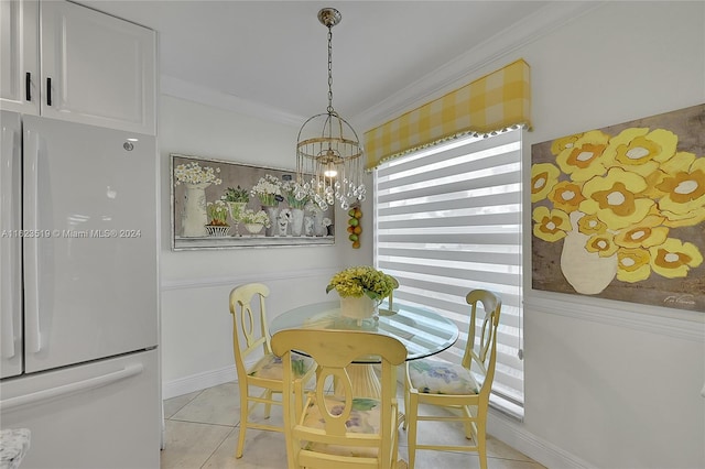 dining room with light tile patterned floors, crown molding, and a chandelier