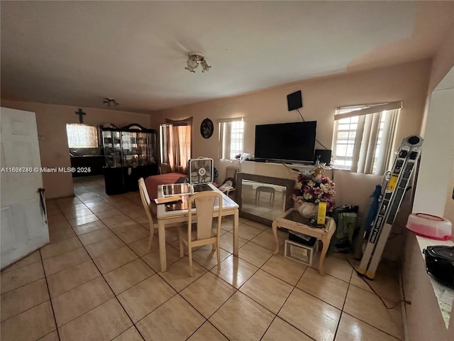 dining space with plenty of natural light and light tile patterned flooring