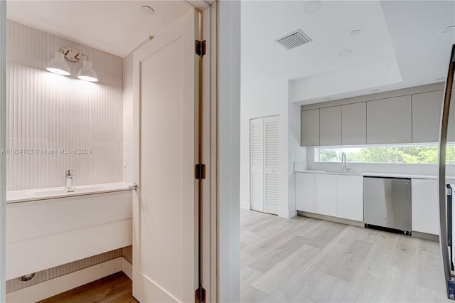 bathroom with sink and hardwood / wood-style floors