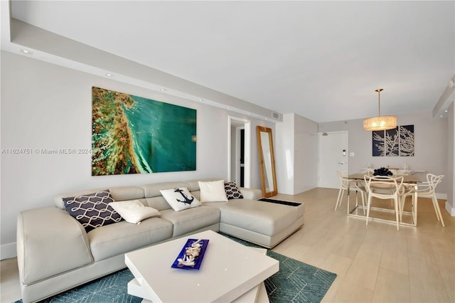 living room with light hardwood / wood-style floors