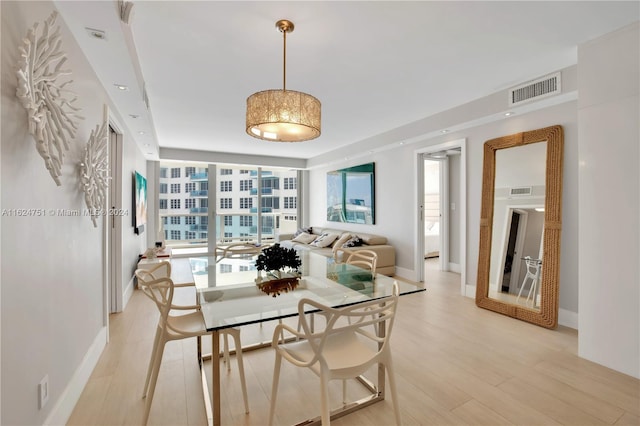 dining area with light wood-type flooring