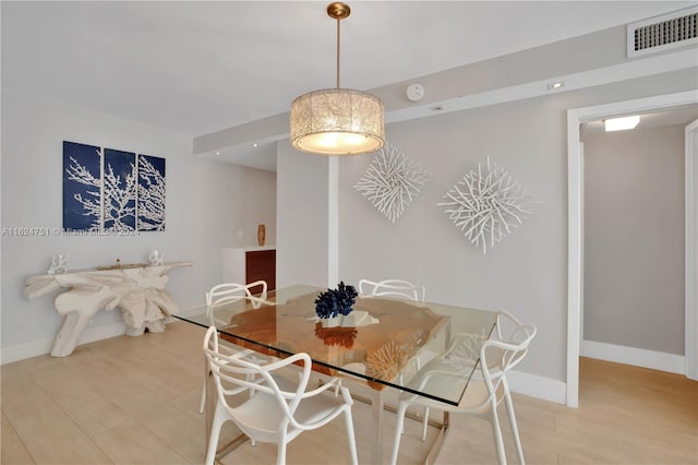 dining area featuring light wood-type flooring