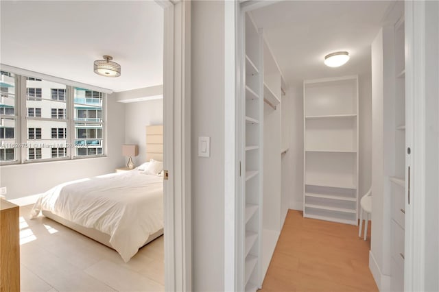 bedroom with hardwood / wood-style flooring