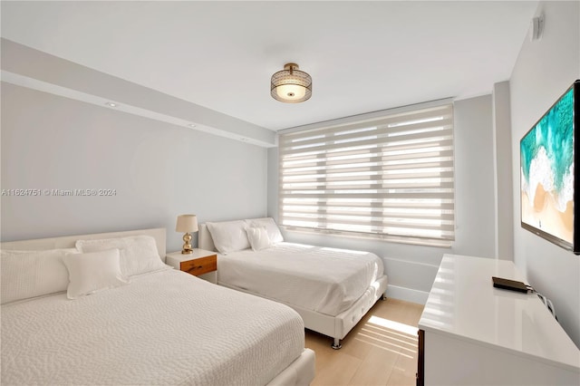 bedroom with light hardwood / wood-style floors