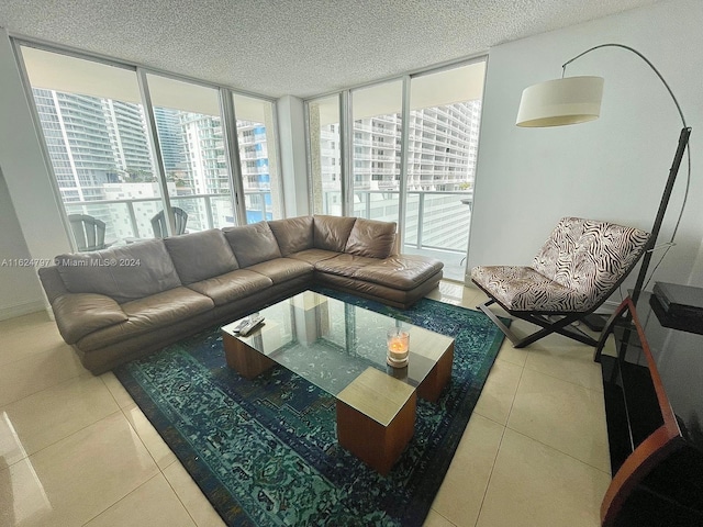 tiled living room with a healthy amount of sunlight and floor to ceiling windows