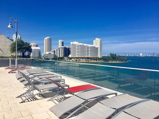 view of pool featuring a water view