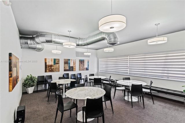 view of carpeted dining area